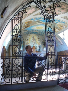 Philip Paris author observing the Rood Screen built by Italian POW soliders